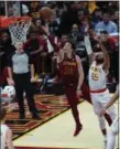  ?? TIM PHILLIS — FOR THE NEWS-HERALD ?? Cedi Osman goes to the basket past the Hawks’ DeAndre’ Bembry on Oct. 21 at Quicken Loans Arena.