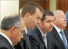  ?? DUNCAN SCOTT — THE NEWS-HERALD ?? Kevin Knoefel, second from left, and his defense team, from left, Dennis N. LoConti, Gary Vick Jr. and Michael J. Connick, stand for the jury in Lake County Common Pleas Court on June 9, 2014, day six of Knoefel’s trial on a charge of conspiracy to...