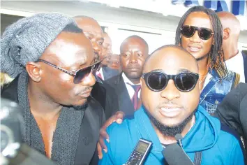  ??  ?? Davido being interviewe­d on arrival in Harare