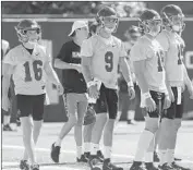  ?? Luis Sinco Los Angeles Times ?? JT DANIELS, second from right, is the presumed USC starter at quarterbac­k, but he is being challenged by Kedon Slovis (9) and Matt Fink, right.