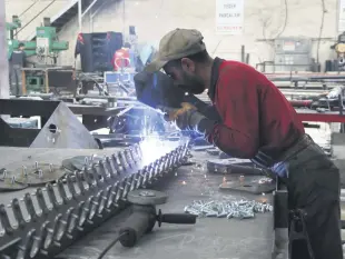  ??  ?? A worker is seen at a factory in central Niğde province, Turkey, June 11, 2020.