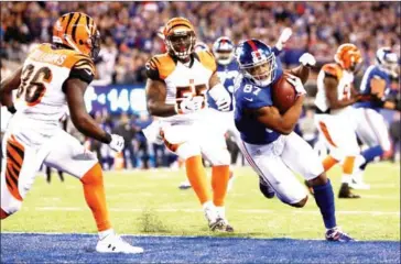  ?? MICHAEL REAVES/GETTY IMAGES/AFP ?? Sterling Shepard of the New York Giants scores a touchdown against the Cincinnati Bengals during the fourth quarter at MetLife Stadium in East Rutherford, New Jersey, on Monday.