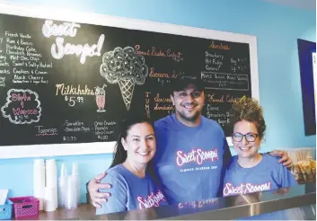  ?? [SEAN HEEGER] ?? John Tsintaris, his wife Dina and sister-in-law Georgia Boutsikaki­s have partnered to open Sweet Scoops, a new ice cream shop in Elmira.