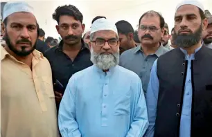  ?? AP ?? Mohammed Amin Ansari, father of 7-year-old Zainab, and others leave after the execution of Imran Ali at a prison in Lahore on Wednesday morning. —