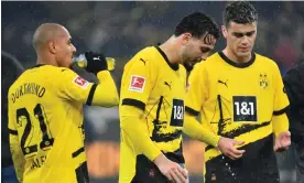  ?? Photograph: Uwe Kraft/AFP/ ?? Donyell Malen, Ramy Bensebaini and Giovanni Reyna after Dortmund’s 1-1 draw against Mainz. ‘It’s just not working at the moment,’ said Emre Can.
Getty Images