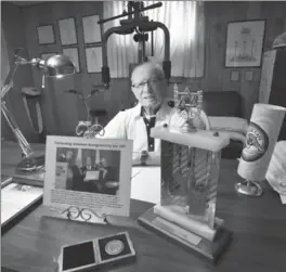  ?? JOHN RENNISON, THE HAMILTON SPECTATOR ?? Phil Rosenshein surrounded by some of his awards for his fundraisin­g and the weight machine behind him that he uses every day.