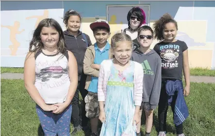  ?? GREG SOUTHAM ?? From left, Katelin Mercer, Jada Prince, Fahad Khan, Myeisha Smith, Remmi Russell, Damien Woodman and Alicia Rohlehr banded together to replace graffiti on an old hockey rink in Inglewood with a mural.