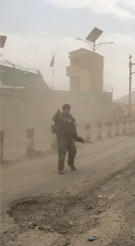  ??  ?? NEVER-ENDING WAR
Soldiers from the Afghan National Army head out on Highway 1 to fight the Taliban after a base near Kabul comes under intense fire. After 20 years of war, the Taliban are in their strongest position since losing control of the country in the wake of 9/11. Douglas Lute, an Army lieutenant general who served as the White House’s Afghan war czar from 2007 to 2013, said that the U.S. dumped huge amounts of money into massive building projects like Highway 1 “to show we could spend it.”