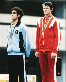  ??  ?? A file picture taken on July 22, 1980 shows (LtoR) French fencer Pascal Jolyot, Russian fencer Vladimir Smirnov posing on the podium with their medal in Moscow during the 1980 Summer Olympics.