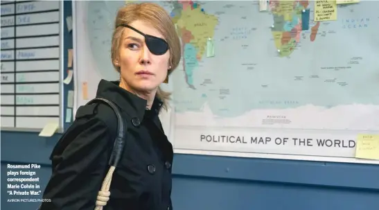  ?? AVIRON PICTURES PHOTOS ?? Rosamund Pike plays foreign correspond­ent Marie Colvin in “A Private War.”