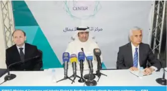  ?? — KUNA ?? KUWAIT: Minister of Commerce and Industry Khaled Al-Roudhan (center) attends the press conference.