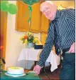  ?? ?? New honorary member Jock Kelso cuts the 125th birthday cake at Shiskine Golf Club.