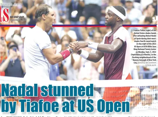  ?? PHOTO BY SARAH STIER/AFP ?? ■ Frances Tiafoe (right) of the United States shakes hands after defeating Rafael Nadal of Spain during their men’s singles fourth round match on day eight of the 2022 US Open at USTA Billie Jean King National Tennis Center on Monday, Sept. 5, 2022 (September 6 in Manila), in the Flushing neighborho­od of the Queens borough of New York City.