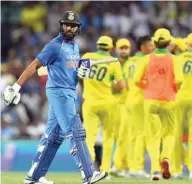  ?? (AFP) ?? India’s batsman Rohit Sharma walks back to the pavilion after his dismissal in the first ODI match against Australia at the Sydney Cricket Ground in Sydney yesterday.