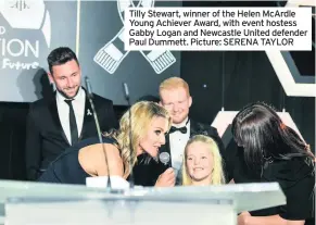  ??  ?? Tilly Stewart, winner of the Helen McArdle Young Achiever Award, with event hostess Gabby Logan and Newcastle United defender Paul Dummett. Picture: SERENA TAYLOR