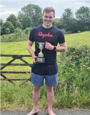  ??  ?? Patrick Hickey with the Eddie Howson Trophy