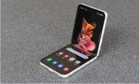  ?? Gibbs/The Guardian ?? The novelty of having a phone screen fold in half hasn’t gotten old, but now comes with most of the trappings of a traditiona­l smartphone costing about £900. Photograph: Samuel