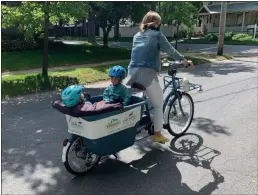  ?? PHOTO PROVIDED ?? A bicyclist totes two children through Saratoga Springs.
