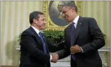  ?? THE ASSOCIATED PRESS PHOTO ?? President Barack Obama greets his Peruvian counterpar­t Ollanta Humala in the Oval Office of the White House in Washington in this 2013file photo. Both leaders discussed the Agreement TransPacif­ic Strategic Economic Partnershi­p.