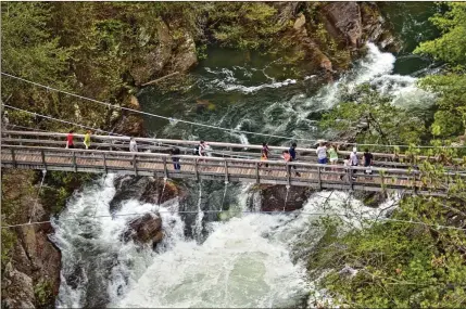  ?? PHOTOS COURTESY OF RABUN COUNTY TOURISM ?? You can view Hurricane Falls from Tallulah Gorge Bridge. The gorge is bounded upstream by a dam.