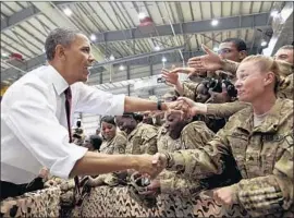  ?? Pete Souza White House ?? PRESIDENT Barack Obama greets U.S. troops after his speech in Afghanista­n.