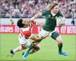  ?? — AFP photo ?? File photo of South Africa’s scrum-half Faf de Klerk (R) scores a try during the Japan 2019 Rugby World Cup quarter-final match between Japan and South Africa at the Tokyo Stadium in Tokyo.