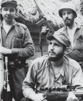  ?? ANDREW ST. GEORGE AP, file 1957 ?? Fidel Castro, center, his younger brother, Raúl, left, and Camilo Cienfuegos pose during their rebellion in Cuba.