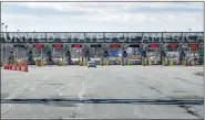  ?? RYAN REMIORZ — THE CANADIAN PRESS VIA AP ?? A vehicle approaches the only open lane at the United States border crossing in Lacolle, Quebec, on Wednesday.