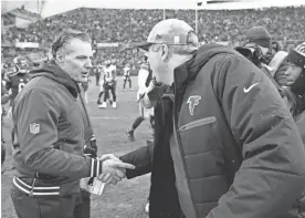  ?? CHARLES REX ARBOGAST/AP FILE ?? Bears head coach Matt Eberflus, left, talks with Falcons head coach Arthur Smith after their Dec. 31 game in Chicago.