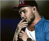  ?? Nicolás Celaya/Xinhua ?? LIAM PAYNE Desde que o grupo anunciou seu hiato por tempo intedeterm­inado, o cantor e compositor inglês optou por lançar singles, ao invés de um álbum cheio. Ele acumula parcerias com nomes como o rapper Quavo (“Strip That Down”), o DJ e produtor Zedd...