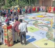  ?? HT PHOTO ?? District authoritie­s organise a 'Snake and Ladder’ game to generate electoral awareness in Barmer on Tuesday.