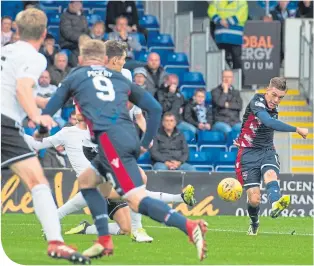  ??  ?? Josh Mullin’s left-footed strike gives County a two-goal advantage