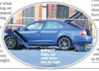  ??  ?? IMPACT Baby car seat base lies on road