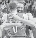  ?? Jon Shapley / Houston Chronicle ?? Ex-teammates James Harden, rear, and Russell Westbrook embrace.