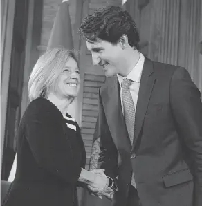  ?? JUSTIN TANG / THE CANADIAN PRESS ?? By aligning himself with Alberta’s Premier Rachel Notley of the NDP, Justin Trudeau has driven a wedge into the divided NDP, writes the Post’s Andrew Coyne.