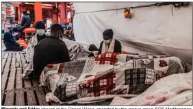  ?? (AP/SOS Mediterran­ee/Flavio Gasperini) ?? Migrants rest Friday aboard of the Ocean Viking, operated by the rescue group SOS Mediterran­ee, after being pulled from rubber dinghies in the Mediterran­ean Sea.