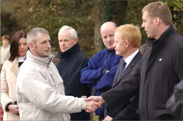  ??  ?? Michael McConville (Left) meets members of the Divisional Search Team responsibl­e for the location of his mother Jean at Templetown Beach. Mother of ten children, Jean McConville from Belfast was kidnapped and murdered by the IRA in 1972 and her body buried at the County Louth beach until discovery in 2003.