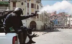  ?? PIC AFP ?? Police firing tear gas at protesters in Antananari­vo yesterday.