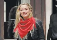  ?? AP PHOTO/MATT DUNHAM ?? Actress Amber Heard smiles at the media as she arrives at the High Court in London on Thursday.
