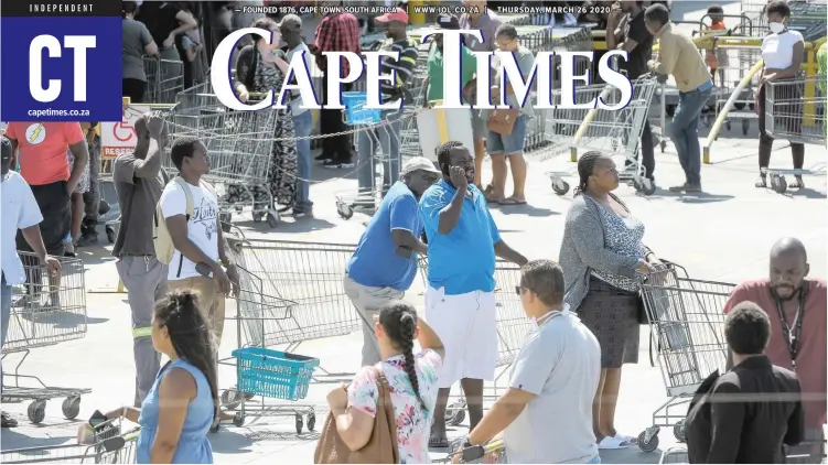  ?? | HENK KRUGER African News Agency (ANA) ?? HUNDREDS of shoppers queue outside Giant Hyper in Brackenfel­l to buy goods before the national lockdown from midnight. President Cyril Rampahosa announced the lockdown on Monday as part of stopping the spread of Covid-19. See page 4