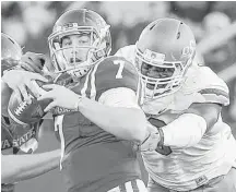  ?? Justin Hayworth / Associated Press ?? Fort Bend Bush graduate Emmanuel Ogbah, right, had 13 sacks last season as a junior at Oklahoma State and was named the top defensive player in the Big 12.