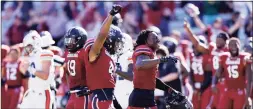  ?? Joe Robbins / Getty Images ?? South Carolina players celebrate after Saturday’ win over Auburn.