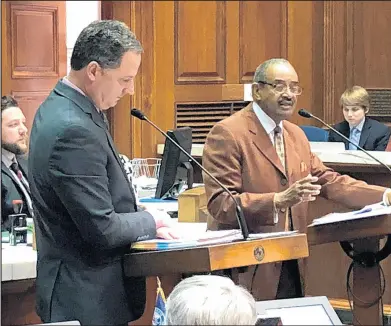  ?? TOM DAVIES/AP ?? Rep. Vernon Smith, D-Gary, right, debates the House Republican budget proposal in 2019 with Indiana House Ways and Means Committee co-chairman Rep. Todd Huston, R-Fishers, in Indianapol­is. Now 76, Smith says the Feb. 18 incident in the House reminded him of racism he endured as a child.