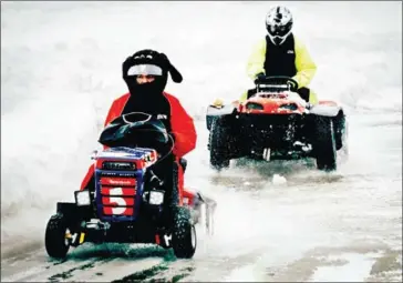  ?? ALESSANDRO RAMPAZZO/AFP ?? The mower of British team Toro Muerto leads the mower of Finnish team Q-ryhma during the fifth edition of the ‘Lawnmower Le Mans’ in Lavia, Finland, on Saturday.