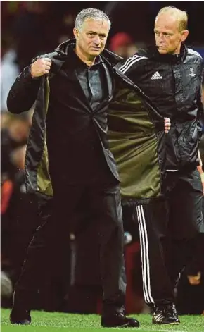  ?? AFP PIC ?? Manchester United manager Jose Mourinho leaves the pitch after their Champions League Group A match against Basel at Old Trafford on Tuesday.