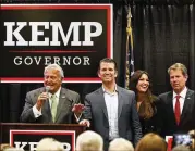  ?? AP ?? Georgia Pubic Service Commission Chairman Lauren “Bubba’” McDonald (left) sings as he stands on stage with Donald Trump Jr., Kimberly Guilfoyle and Republican nominee for governor Brian Kemp in Athens.