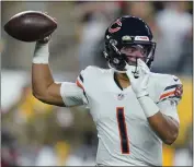  ?? GENE J. PUSKAR — THE ASSOCIATED PRESS, FILE ?? Bears quarterbac­k Justin Fields passes against the Steelers during the first half of a November 2021game in Pittsburgh. The Bears traded Fields to the Steelers on Saturday, according to a person informed of the deal.