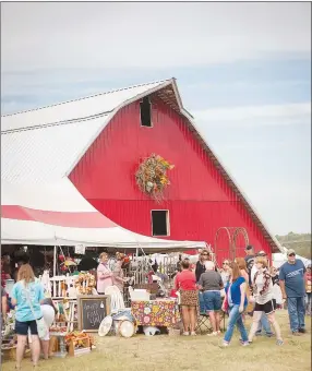  ?? Lara Jo Hightower/Courtesy photo ?? The first Junk Ranch was held in September of 2013 at the Viney Grove Community Center in Prairie Grove — and it was mobbed. It didn’t take long for founders Amy Daniels and Julie Speed to realize the potential of the “barn sale” and move to a bigger location.