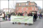  ?? NICHOLAS BUONANNO- NBUONANNO@TROYRECORD.COM ?? The Irish step dancers group marches in the Hoosick Falls St. Patrick’s Day parade Saturday afternoon.