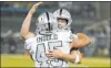  ?? D. Ross Cameron The Associated Press ?? Fullback Alec Ingold celebrates a touchdown reception against the Chargers with Raiders quarterbac­k Derek Carr.